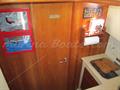 Rodman 870 Fly puerta cabina